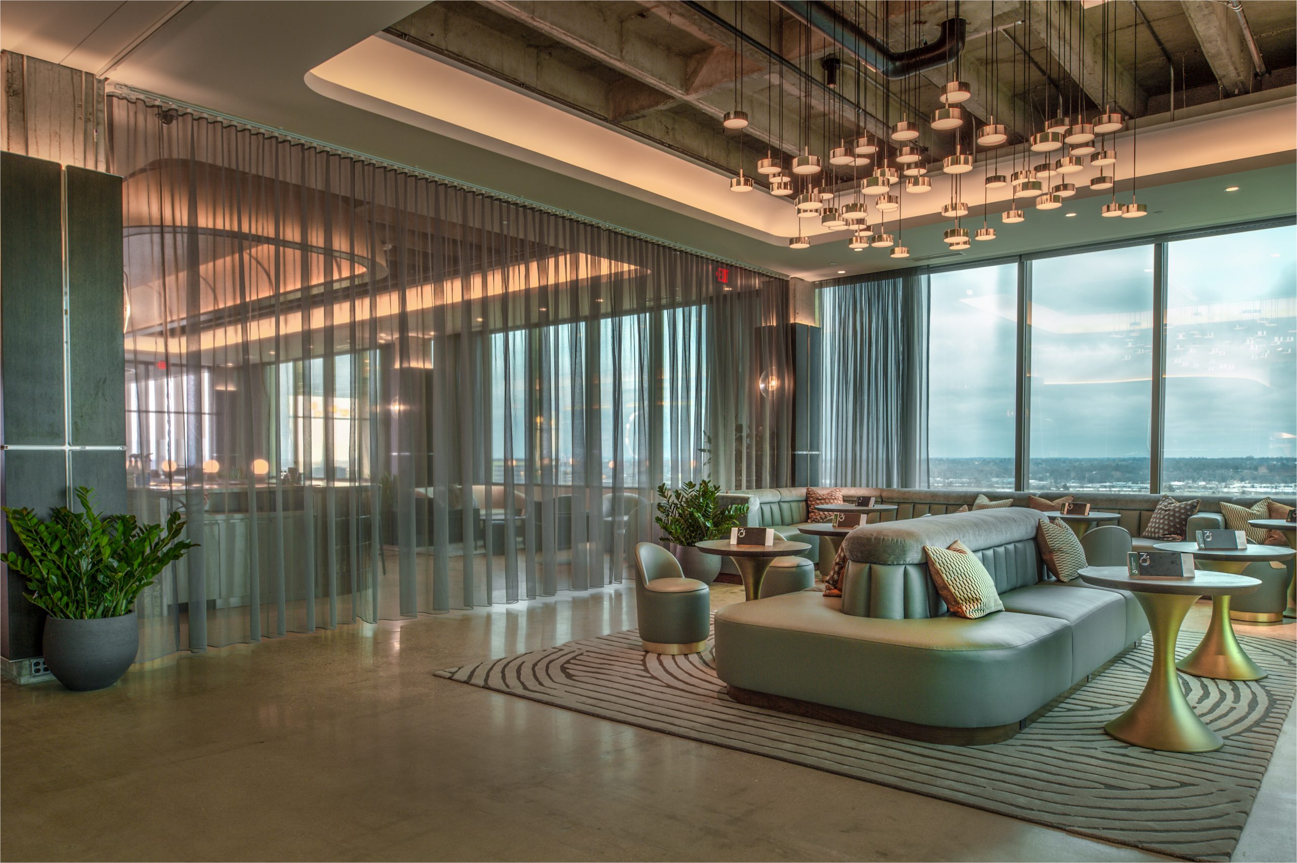 360 westport daytime with sofa, windows and sheer curtain pulled